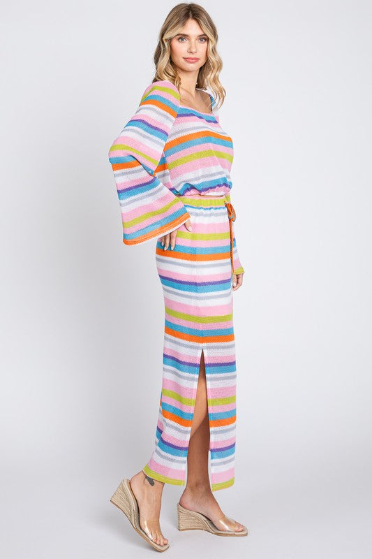 Multi-color striped maxi skirt by Jade Icarus, featuring flowing fabric and vibrant horizontal stripe pattern.