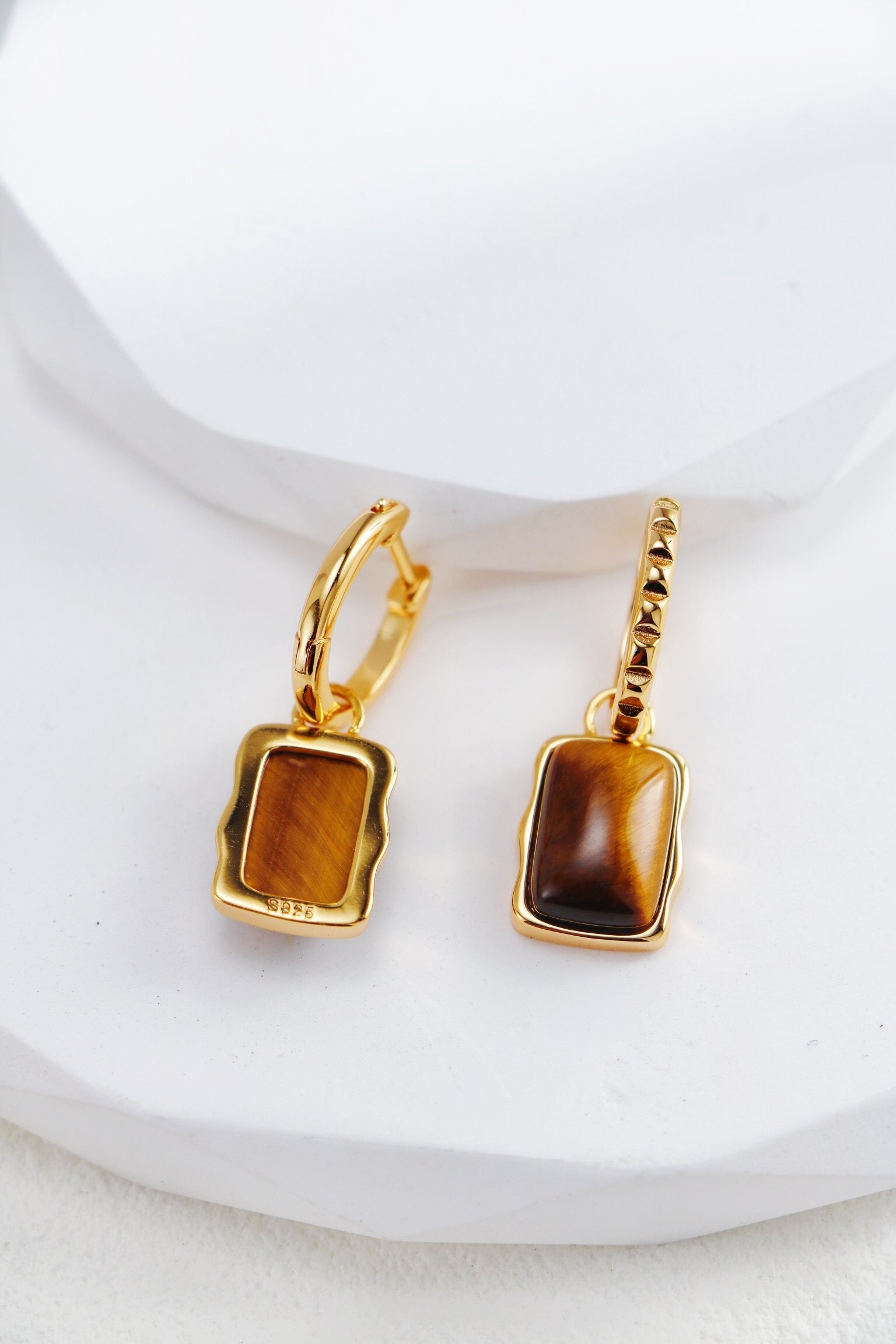 Rectangle-shaped tiger eye long earrings from Amethyst Arachne, featuring polished gold-tone hooks and striking gemstone details.