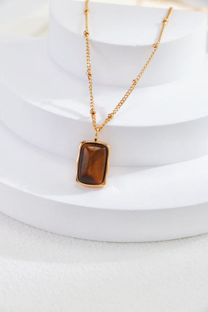 Rectangle-shaped tiger eye long earrings by Amethyst Arachne featuring polished gemstone drops and gold-tone hooks.