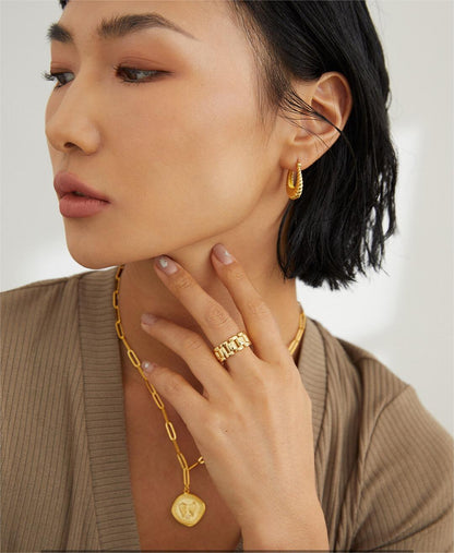 Twisted stripe stud earrings by Amethyst Arachne featuring silver and black designs in a jewelry and watches collection.