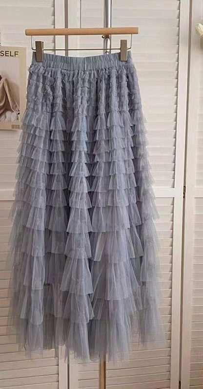 Automotive tiered midi skirt by Jade Icarus featuring layered fabric design and stylish silhouette.