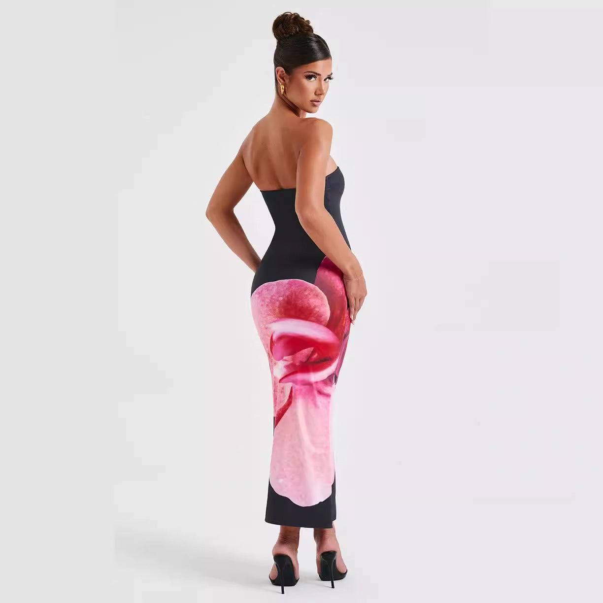Backless floral draped tube maxi dress by Carmine Juneberry, elegant floral pattern and flowing fabric for a stylish look.