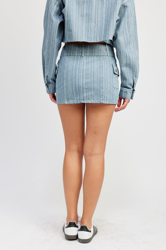 Jade Icarus belted mini denim skirt with automotive-inspired design, featuring visible belt and stylish denim fabric.