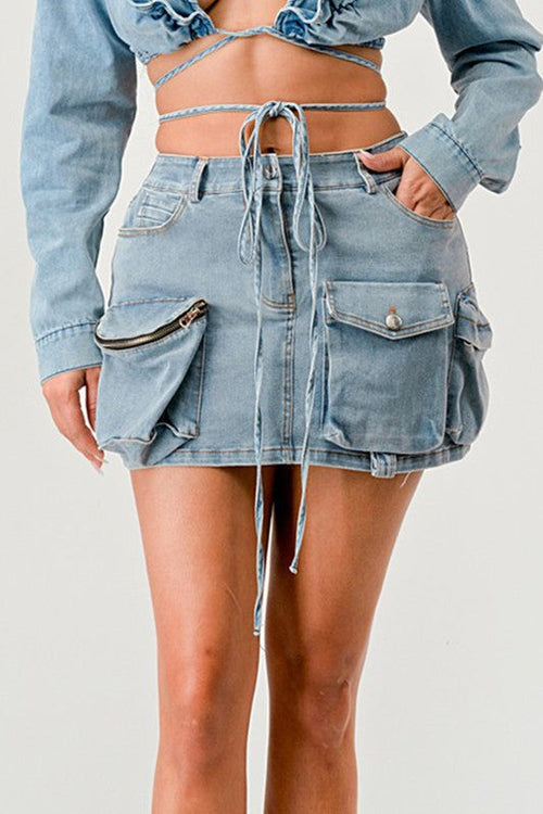 Jade Icarus Denim Daze Wrap Skirt in denim fabric with a stylish wrap design, shown on a mannequin.