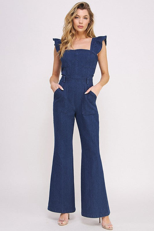 Women’s denim ruffle flare leg jumpsuit by Jade Icarus, featuring ruffled details and wide flare legs, styled for casual elegance.