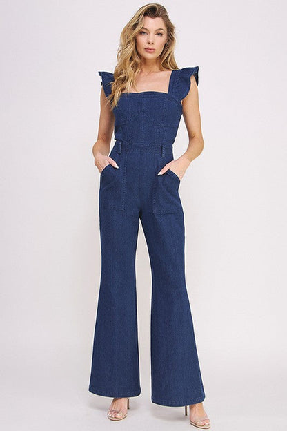 Women’s denim ruffle flare leg jumpsuit by Jade Icarus, featuring ruffled details and wide flare legs, styled for casual elegance.