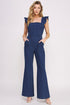 Women’s denim ruffle flare leg jumpsuit by Jade Icarus, featuring ruffled details and wide flare legs, styled for casual elegance.