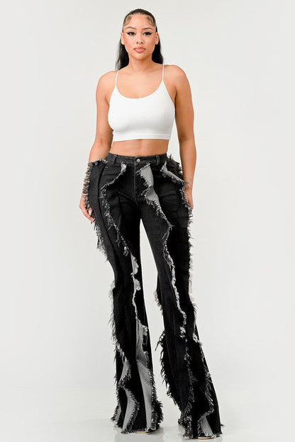 Distressed denim frill jeans by Jade Icarus featuring ripped details and frilled hem, casual and trendy women&