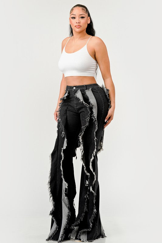 Distressed Jade Icarus denim frill jeans with ripped details and frilled hem, showcasing trendy distressed jeans style.