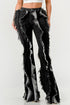 Distressed denim frill jeans by Jade Icarus featuring ruffled details and a trendy, worn-in look.