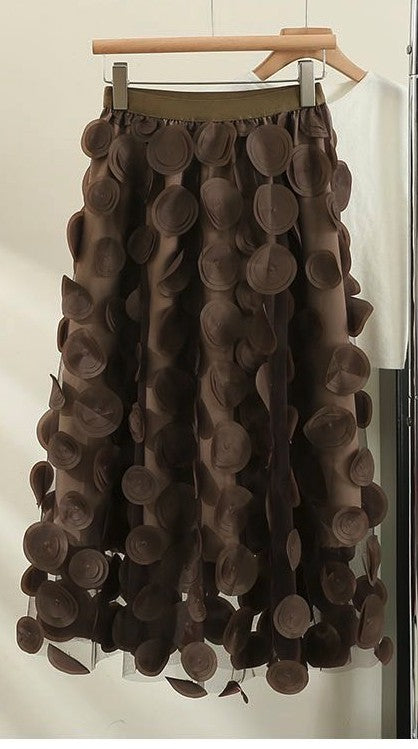 Polka dot skirt from Jade Icarus featuring a classic pattern, displayed on a mannequin with a focus on fabric and design details.