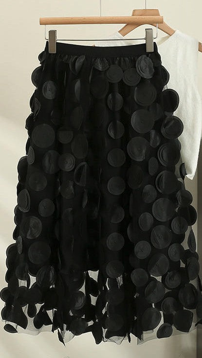 Polka dot skirt from Jade Icarus, showcasing its automotive-inspired design with bold black and white polka pattern.