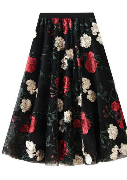 Rose pattern midi skirt from Jade Icarus, featuring floral design and flowing fabric in natural light.