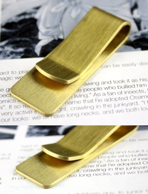 Brass money clip from Fuchsia Molly, stylish home decor accessory with a sleek, polished finish and minimalist design.