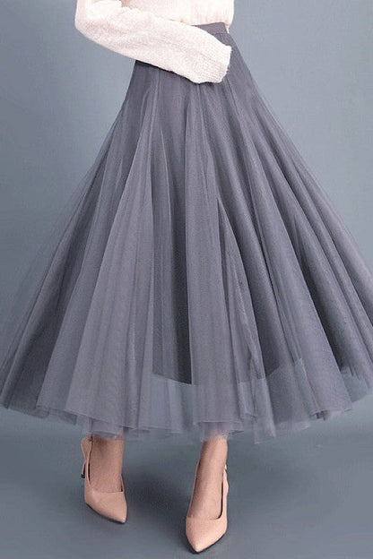 Automotive Jade Icarus midi skirt with sleek design and detailed stitching, displayed on a mannequin.