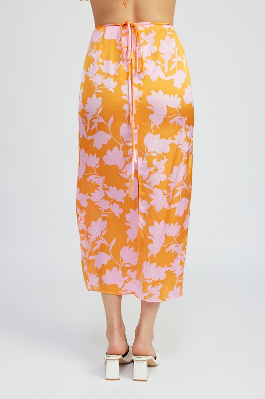 Automotive part from Jade Icarus featuring a ruched maxi skirt with waist drawstring, displayed on a vehicle.