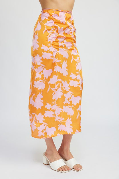 Jade Icarus ruched maxi skirt with waist drawstring, featuring a flowy fabric and stylish design, displayed on a model.