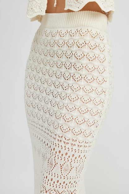 Automotive fitting crochet maxi skirt with slit by Jade Icarus, styled as a fashion garment in a detailed image.