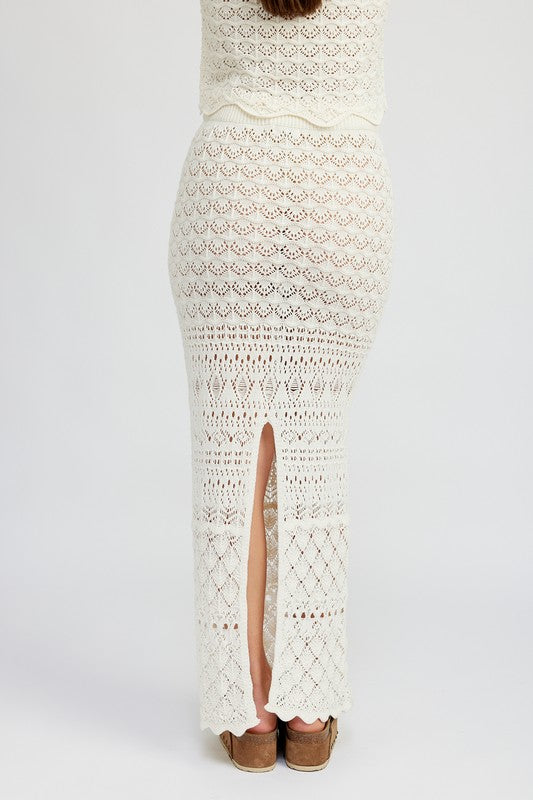Automotive fitted crochet maxi skirt with slit by Jade Icarus, featuring detailed crochet pattern and stylish slit design.
