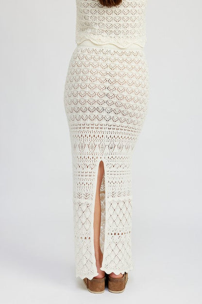 Automotive fitted crochet maxi skirt with slit by Jade Icarus, featuring detailed crochet pattern and stylish slit design.