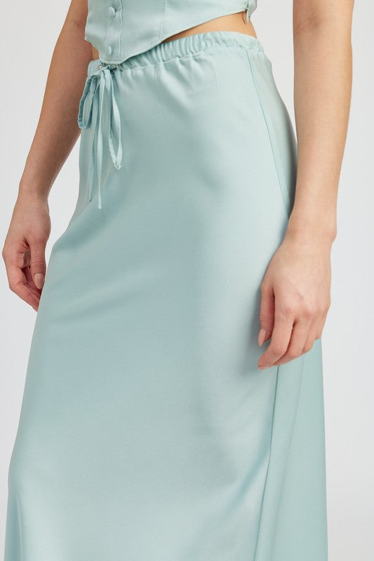 Satin midi skirt with tie-front design by Jade Icarus, shown in a sleek automotive-inspired style.