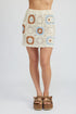 Automotive high waist crochet mini skirt by Jade Icarus, featuring detailed crochet design and fitted style.