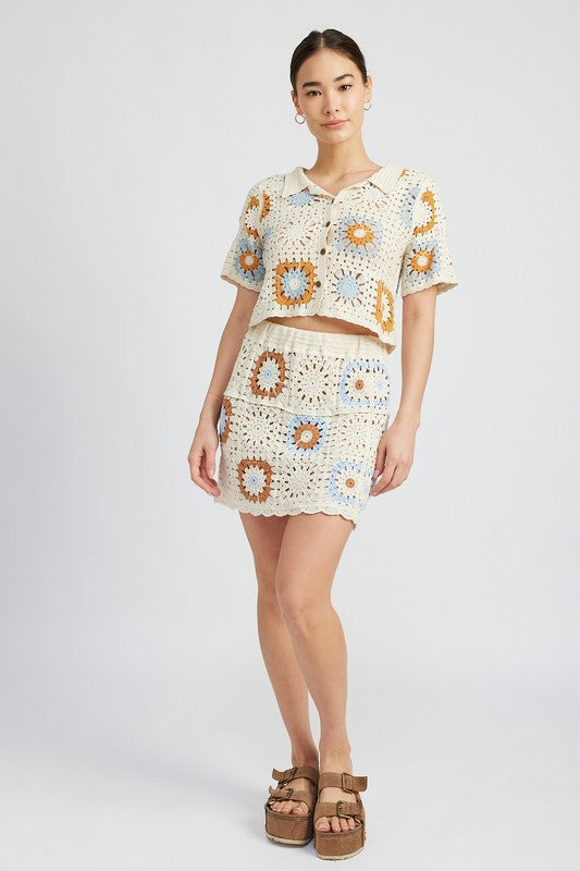 High waist crochet mini skirt by Jade Icarus, showcasing intricate crochet pattern and stylish fit.
