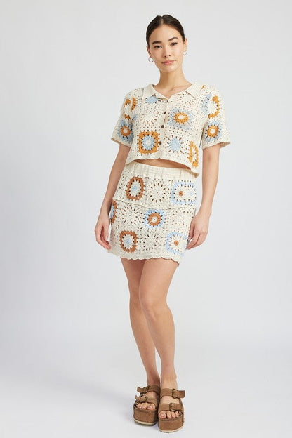 High waist crochet mini skirt by Jade Icarus, showcasing intricate crochet pattern and stylish fit.