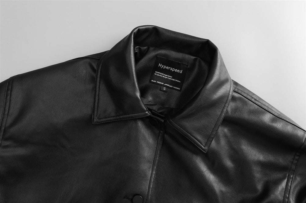Black Drive Moto Jacket by Carmine Juneberry, Haute Edition 25, featuring a stylish leather motorcycle design and silver hardware.