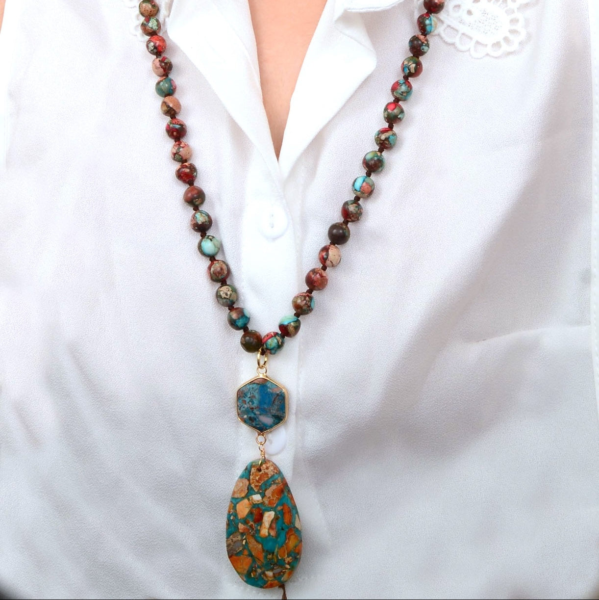 Rainbow Jasper long pendant necklace featuring a multicolored gemstone on a silver chain, jewelry by Start2Finish.