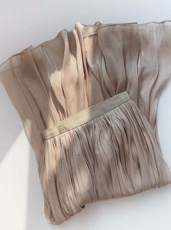 Mid-length Jade Icarus A-line skirt in soft fabric, shown on a model, highlighting its flowy silhouette and stylish design.