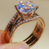 Pair of 18K gold moissanite rings from Carmine Juneberry showcasing elegant, versatile jewelry with sparkling gemstone accents.