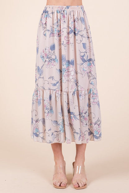Automotive Jade Icarus Ruffle Bottom Floral Print Skirt with ruffled hem and vibrant floral design, displayed on a mannequin.