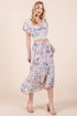 Automotive part from Jade Icarus featuring a ruffle bottom floral print design in vibrant colors.