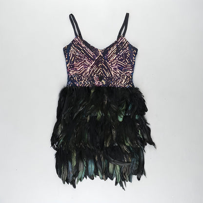 Sparkling sleeveless sequins dress with suspenders from Carmine Juneberry, featuring a fitted skirt design with tight, shimmering fabric.