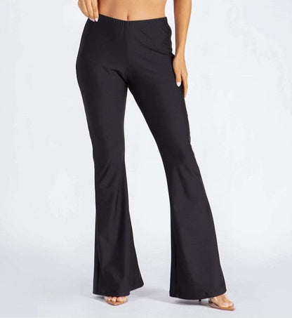 Jade Icarus basic pants with flared legs, featuring a fitted waistband and flowing fabric, shown on a model.