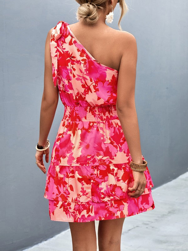 Women’s summer one-shoulder flowy short dress by Jade Icarus, featuring lightweight fabric and a relaxed fit for warm weather.