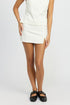 Jade Icarus mini skirt with side slit detail, fitted style in lightweight fabric, shown on a model.