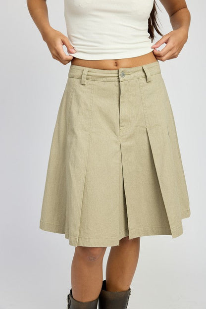Jade Icarus knee-length pleated skirt, automotive-themed design with pleats, displayed on a mannequin.
