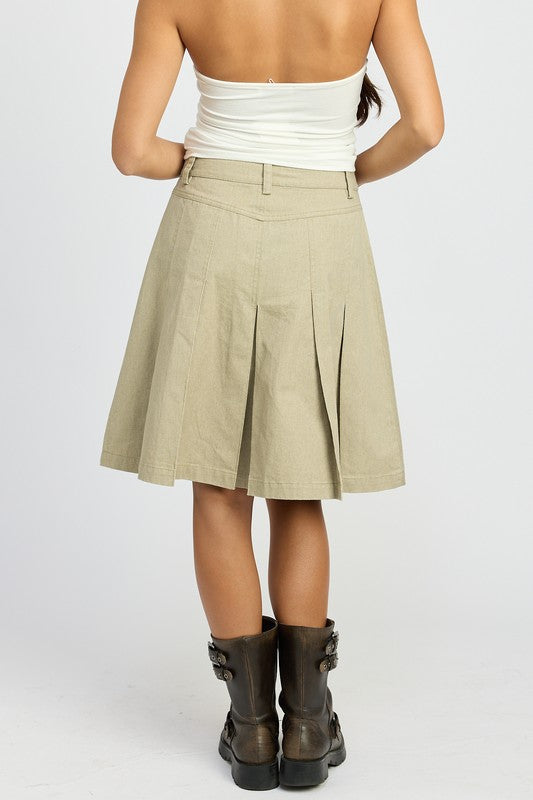Jade Icarus knee-length pleated skirt with automotive-inspired design, displayed on a model or flat lay.