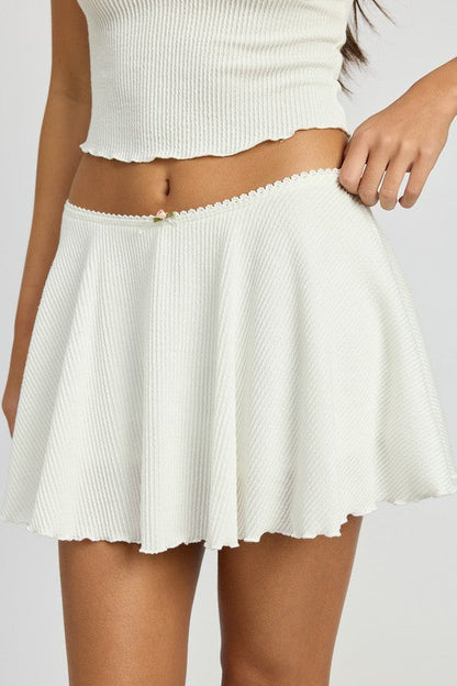 Jade Icarus Circle Mini Skirt in automotive style featuring a sleek, modern design with circular pattern details.