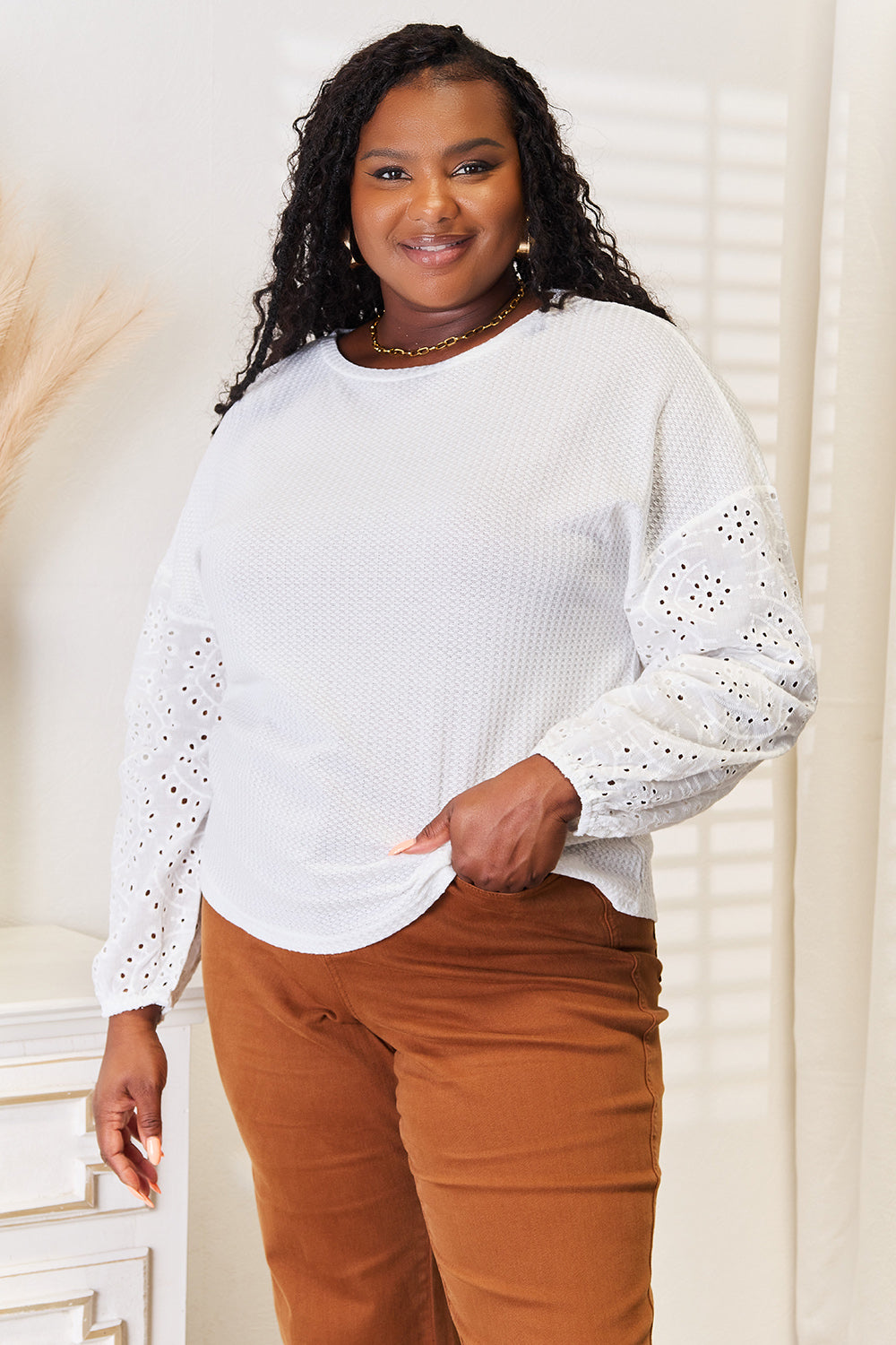 Shiny eyelet dropped shoulder round neck blouse by Pear Daisy, featuring a stylish design with eyelet details and a glossy finish.