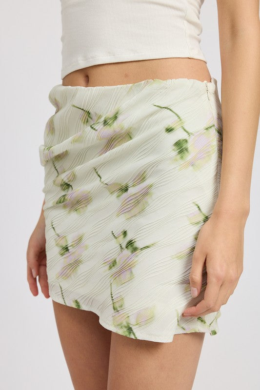 Automotive-themed floral pencil skirt with side slit by Jade Icarus, featuring a fitted silhouette and vibrant floral pattern.