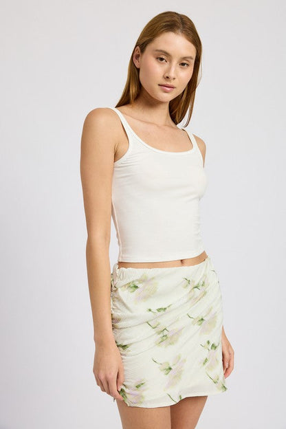 Automotive floral pencil skirt with side slit by Jade Icarus, featuring a fitted silhouette and floral pattern.