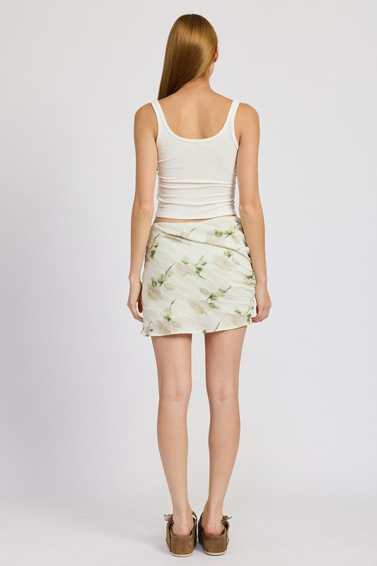 Automotive floral pencil skirt with side slit by Jade Icarus, featuring a fitted design and stylish pattern.