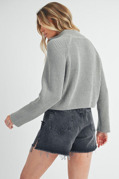Jade Icarus Debbie half-zip sweater for women, soft knit fabric, in a stylish design with a high collar and long sleeves.