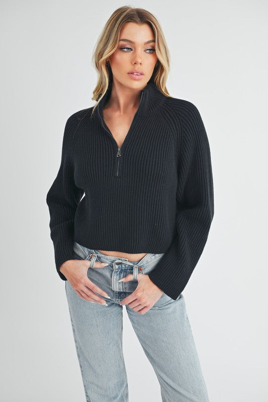 Jade Icarus Debbie Half-Zip Sweater for women, cozy knit with a half-zip front and ribbed cuffs, in a soft neutral color.