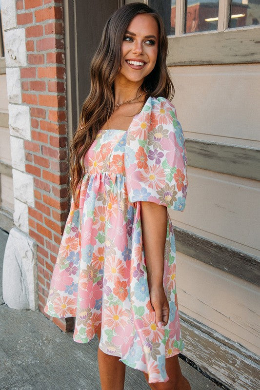 Women’s square neck puff sleeve babydoll dress by Jade Icarus, featuring a flowy silhouette and stylish puffed sleeves.