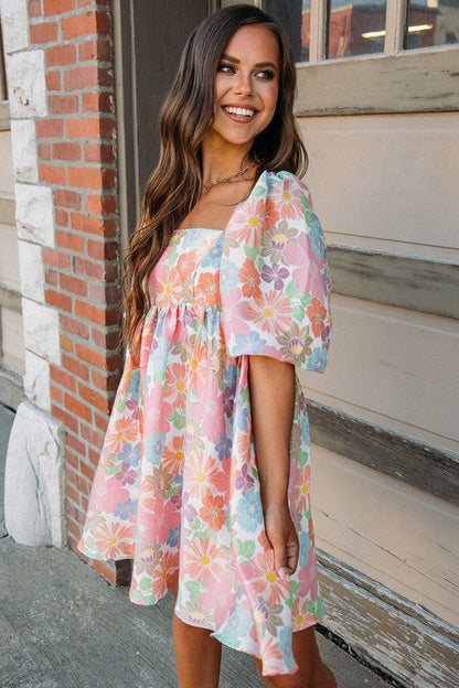Women’s square neck puff sleeve babydoll dress by Jade Icarus, featuring a flowy silhouette and stylish puffed sleeves.