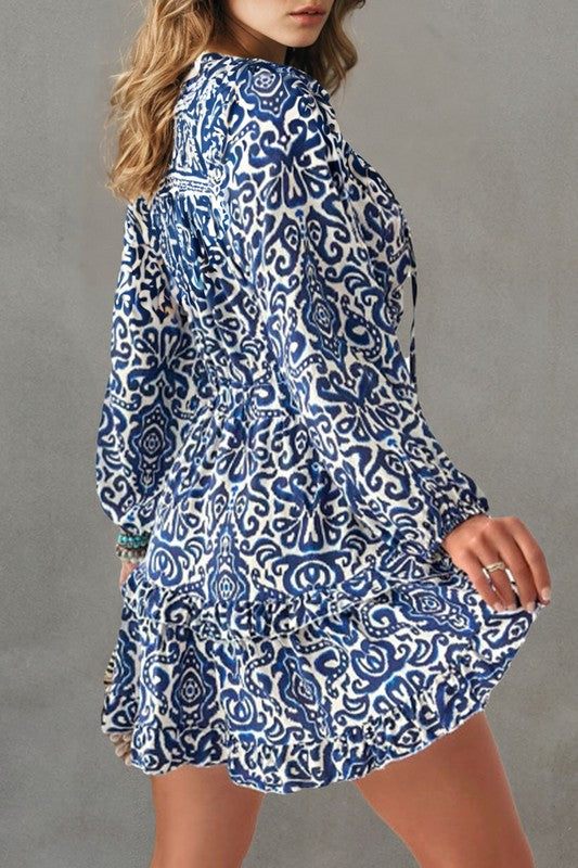 Geometric ruffled V-neck mini dress by Jade Icarus with drawstring waist, featuring a stylish automotive-inspired design.